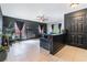 Stylish living room with tile floors, modern black walls, fireplace and lots of natural light at 4932 Goldeneye Way, North Las Vegas, NV 89031