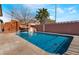 Inviting swimming pool features a rock waterfall, sunny exposure, and plenty of room to swim at 4932 Goldeneye Way, North Las Vegas, NV 89031