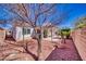 This backyard features low maintenance landscaping and a covered patio at 5295 Acqua Ln, Pahrump, NV 89061