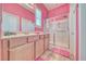 Brightly painted bathroom featuring a vanity with a sink, a shower, and tile flooring at 5295 Acqua Ln, Pahrump, NV 89061