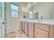 Bright bathroom features double sinks, lots of counterspace, and neutral flooring at 5295 Acqua Ln, Pahrump, NV 89061