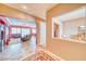 Open-concept living room featuring plush seating, a fireplace, and abundant natural light at 5295 Acqua Ln, Pahrump, NV 89061