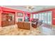 Inviting living room with fireplace, plush seating, and abundant natural light from sliding glass doors at 5295 Acqua Ln, Pahrump, NV 89061