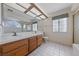 Bathroom with a double sink vanity and a tile floor at 544 Cervantes Dr, Henderson, NV 89014