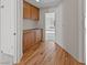 Hallway with wood floors and built-in cabinets leads to a room with a window seat at 544 Cervantes Dr, Henderson, NV 89014