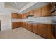 Classic kitchen featuring wood cabinetry, granite countertops, and tile backsplash at 544 Cervantes Dr, Henderson, NV 89014