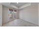 Sunlit room with tile flooring and glass patio doors that lead to the outside at 544 Cervantes Dr, Henderson, NV 89014