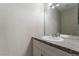 Powder room featuring a white vanity with granite counters and a large framed mirror at 5939 Vegas Dr, Las Vegas, NV 89108