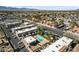 A high angle aerial view showing a community with a pool and surrounding buildings at 5939 Vegas Dr, Las Vegas, NV 89108