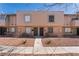 A two-story townhome with a neutral facade offers a convenient walkway and low-maintenance landscaping at 5939 Vegas Dr, Las Vegas, NV 89108