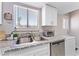 Close-up of the stainless steel sink and granite countertop in the well-appointed kitchen at 5939 Vegas Dr, Las Vegas, NV 89108