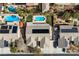 Aerial view of home with a fenced in backyard, pool, and solar panels on the roof at 5968 Saint Lazare St, Las Vegas, NV 89130