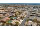 This is a high aerial shot of the neighborhood, highlighting the houses, streets, desert landscaping and community at 5968 Saint Lazare St, Las Vegas, NV 89130