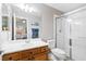 Bathroom featuring a double vanity, toilet, and separate shower with glass enclosure at 5968 Saint Lazare St, Las Vegas, NV 89130