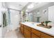 Well-lit bathroom with a shower-tub combo, vanity with storage, and modern fixtures at 5968 Saint Lazare St, Las Vegas, NV 89130