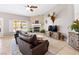 Inviting living room with a fireplace, comfortable seating, and a view of the pool at 5968 Saint Lazare St, Las Vegas, NV 89130