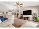 Open living room with high ceilings, neutral tones, plush carpeting, and a glimpse of the entryway at 5968 Saint Lazare St, Las Vegas, NV 89130