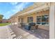 A lovely patio seating area offers ample space for relaxation and entertaining with a view of the pool at 5968 Saint Lazare St, Las Vegas, NV 89130