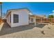 Backyard with desert landscaping, a covered patio, and partial view of the house at 6412 Yarmouth Dr, Las Vegas, NV 89108