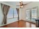 Dining Area featuring wood floors, lots of natural light, and access to the backyard at 6412 Yarmouth Dr, Las Vegas, NV 89108