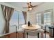 Bright dining area featuring staged round table with modern chairs at 6412 Yarmouth Dr, Las Vegas, NV 89108