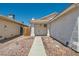 Single-story home featuring a welcoming front entry and easy-care desert landscaping at 6412 Yarmouth Dr, Las Vegas, NV 89108