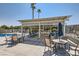 Outdoor community pool featuring a covered dining area with tables and chairs for residents at 6412 Yarmouth Dr, Las Vegas, NV 89108