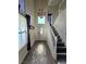 Bright foyer featuring a staircase, chandelier, and tile flooring, creating an inviting entrance to the home at 6632 Ives Ave, Las Vegas, NV 89108