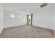 Bright bedroom with neutral walls, carpet, and natural light at 7083 Mackenzie Bay Ave, Las Vegas, NV 89179