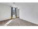 Simple bedroom featuring plush carpeting, a window and natural light at 7083 Mackenzie Bay Ave, Las Vegas, NV 89179