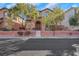 Charming home featuring a stone-accented entrance, landscaped yard, and a welcoming front facade at 7083 Mackenzie Bay Ave, Las Vegas, NV 89179