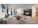 Bright living room with modern decor, neutral color scheme, and lots of natural light. (Virtually Staged) at 7083 Mackenzie Bay Ave, Las Vegas, NV 89179