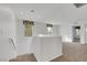 Upstairs loft space featuring carpeted floor, neutral walls, and natural light at 7083 Mackenzie Bay Ave, Las Vegas, NV 89179