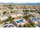 A vibrant community of homes featuring solar panels and desert landscaping, promoting energy efficiency at 7757 Coast Jay St, North Las Vegas, NV 89084