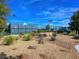 Community basketball court featuring new lights, manicured landscaping and decorative rocks at 7757 Coast Jay St, North Las Vegas, NV 89084