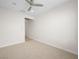 Unfurnished bedroom with carpet flooring, and entryway at 7757 Coast Jay St, North Las Vegas, NV 89084