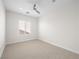 Bedroom with neutral carpet, blinds on the window and bright, neutral paint at 7757 Coast Jay St, North Las Vegas, NV 89084