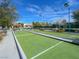 Community bocce ball court featuring a manicured green surface and benches at 7757 Coast Jay St, North Las Vegas, NV 89084