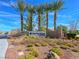 Palm trees accent the Sun City Aliante community entrance with desert landscaping at 7757 Coast Jay St, North Las Vegas, NV 89084