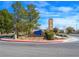 Well-maintained community entrance with lush landscaping, clear signage, and a decorative tower welcomes residents and visitors alike at 7757 Coast Jay St, North Las Vegas, NV 89084