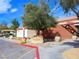 View of the Aliante Golf Club entrance with planters and mature landscaping at 7757 Coast Jay St, North Las Vegas, NV 89084