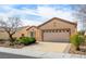 Charming single-story home features a well-manicured front yard and a two-car garage at 7757 Coast Jay St, North Las Vegas, NV 89084