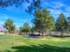 A serene view of the meticulously manicured golf course, featuring lush green fairways and the silhouette of mountains at 7757 Coast Jay St, North Las Vegas, NV 89084