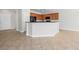 A clear shot of the kitchen island and cabinets, showcasing the potential and neutral color scheme at 7757 Coast Jay St, North Las Vegas, NV 89084