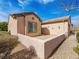 Private patio features stucco walls and desert landscaping at 7757 Coast Jay St, North Las Vegas, NV 89084