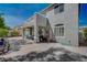 Picturesque backyard with a large patio, balcony, desert landscaping, and a covered area for outdoor dining at 7905 Brent Leaf Ave, Las Vegas, NV 89131