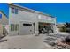 Inviting backyard featuring an extended patio, balcony, seating area, drought resistant landscaping, and lots of shade at 7905 Brent Leaf Ave, Las Vegas, NV 89131