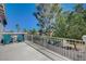 Spacious balcony overlooking lush greenery and palm trees, perfect for outdoor seating at 7905 Brent Leaf Ave, Las Vegas, NV 89131