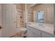 Bathroom featuring shower with glass door, white vanity, and view into the bedroom at 7905 Brent Leaf Ave, Las Vegas, NV 89131