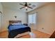 Bright bedroom with wood-look floors and a comfortable bed at 7905 Brent Leaf Ave, Las Vegas, NV 89131